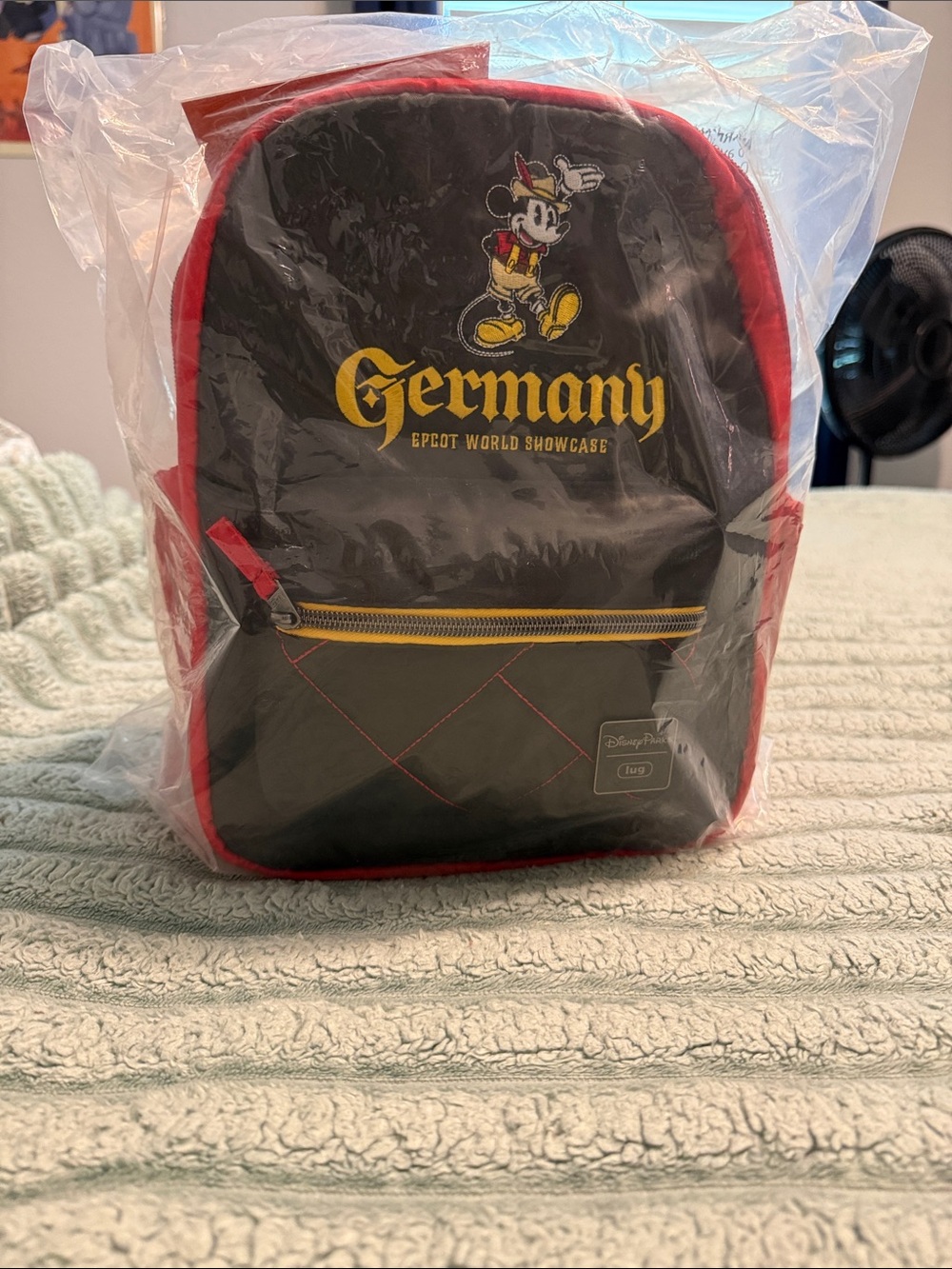 lug Germany Black Mini Backpack with Red Trim and Yellow Accents